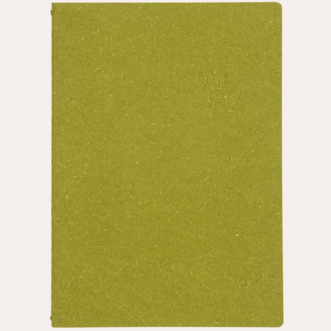 Amber Fields olive green lined notebook flat lay – natural texture straw-fiber cover journal